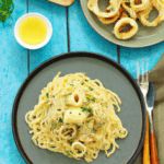 enetian-alamari-ith-picy-auce-nd-gg-ettuccine.png